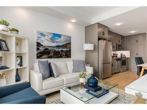 1107-350 Livingston Common Ne, Calgary, AB - Indoor Photo Showing Living Room