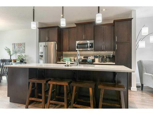 173 Willow Street, Cochrane, AB - Indoor Photo Showing Kitchen With Stainless Steel Kitchen With Upgraded Kitchen