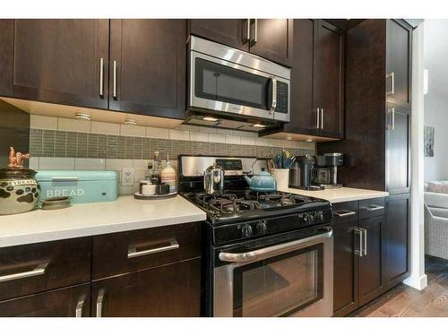 173 Willow Street, Cochrane, AB - Indoor Photo Showing Kitchen With Upgraded Kitchen