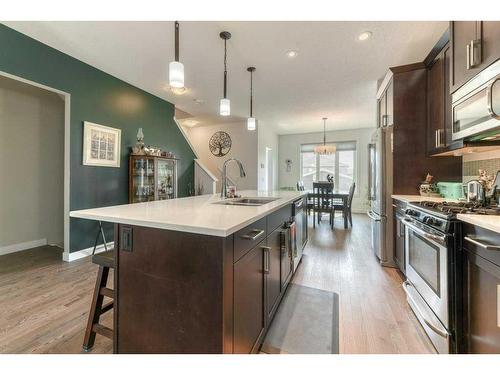 173 Willow Street, Cochrane, AB - Indoor Photo Showing Kitchen With Stainless Steel Kitchen With Double Sink With Upgraded Kitchen