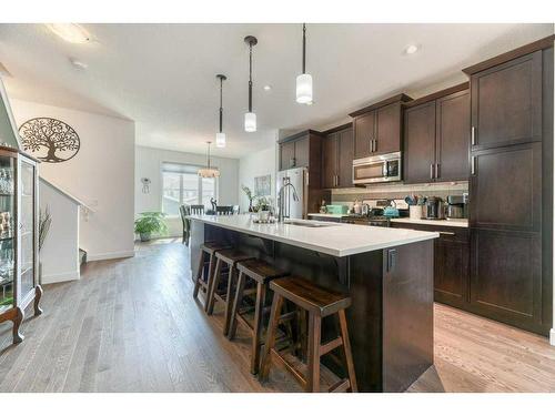 173 Willow Street, Cochrane, AB - Indoor Photo Showing Kitchen With Upgraded Kitchen