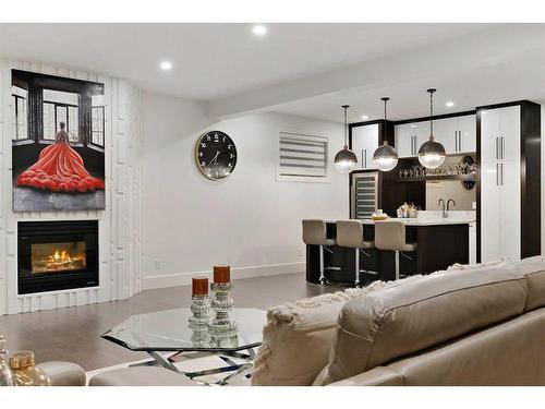 108 Patterson Drive Sw, Calgary, AB - Indoor Photo Showing Living Room With Fireplace