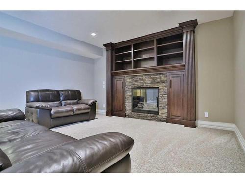 66 Silverado Ranch Way Sw, Calgary, AB - Indoor Photo Showing Living Room With Fireplace