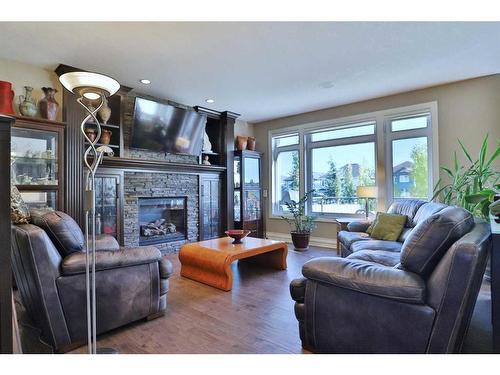 66 Silverado Ranch Way Sw, Calgary, AB - Indoor Photo Showing Living Room With Fireplace