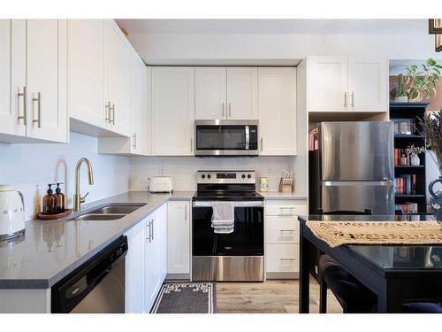 3415-298 Sage Meadows Park Nw, Calgary, AB - Indoor Photo Showing Kitchen With Stainless Steel Kitchen With Double Sink With Upgraded Kitchen