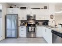 26 Walden Path Se, Calgary, AB  - Indoor Photo Showing Kitchen With Stainless Steel Kitchen With Double Sink 