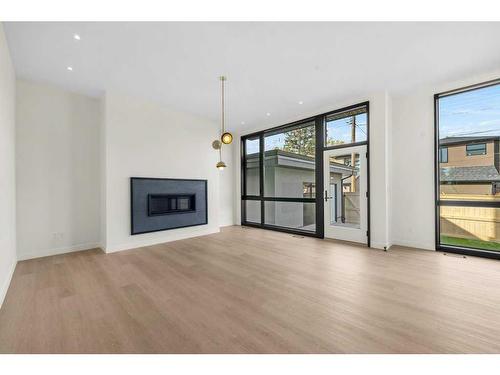 3A Willow Crescent Sw, Calgary, AB - Indoor Photo Showing Living Room With Fireplace