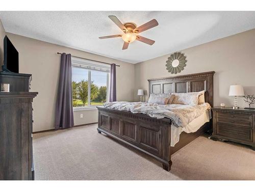 14 Drake Landing Crescent, Okotoks, AB - Indoor Photo Showing Bedroom