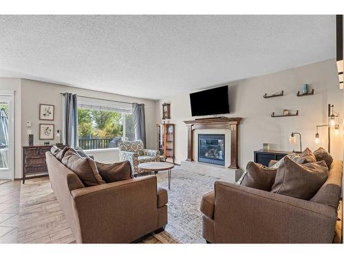 14 Drake Landing Crescent, Okotoks, AB - Indoor Photo Showing Living Room With Fireplace