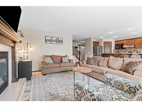 14 Drake Landing Crescent, Okotoks, AB - Indoor Photo Showing Living Room With Fireplace