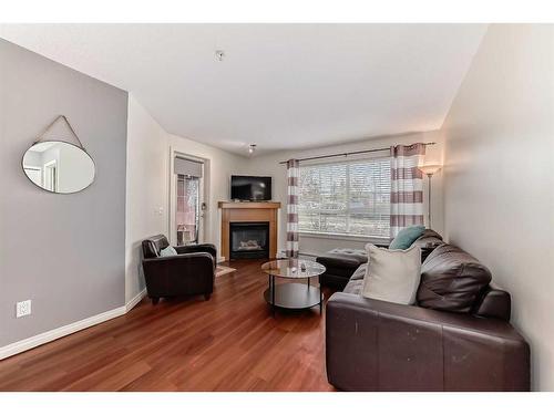 107-5115 Richard Road Sw, Calgary, AB - Indoor Photo Showing Living Room With Fireplace