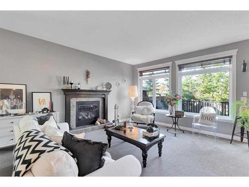 101 West Coach Place Sw, Calgary, AB - Indoor Photo Showing Living Room With Fireplace