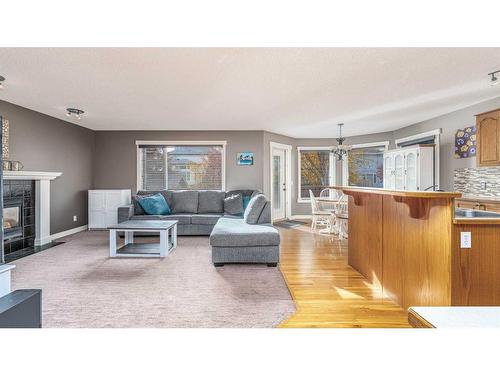 150 Citadel Ridge Close Nw, Calgary, AB - Indoor Photo Showing Living Room With Fireplace