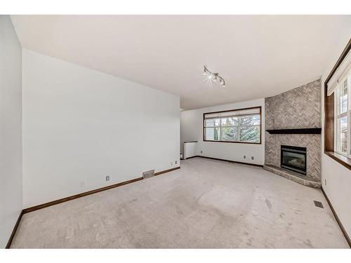 114 Bow Ridge Crescent, Cochrane, AB - Indoor With Fireplace