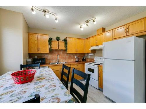 1405-111 Tarawood Lane Ne, Calgary, AB - Indoor Photo Showing Kitchen With Double Sink