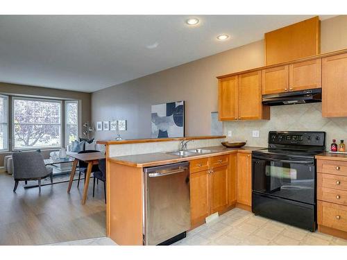 503-2005 Luxstone Boulevard Sw, Airdrie, AB - Indoor Photo Showing Kitchen With Double Sink