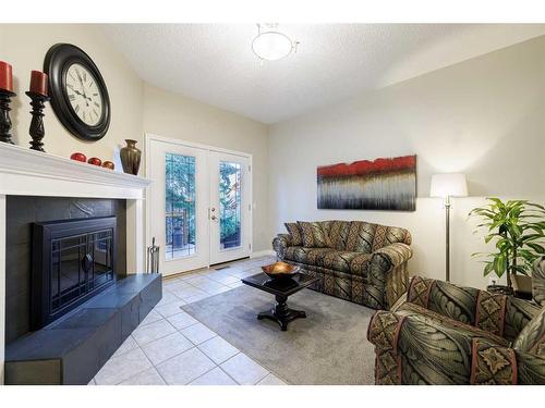 152 Whitlock Close Ne, Calgary, AB - Indoor Photo Showing Living Room With Fireplace