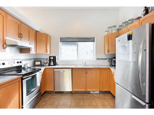 38 Coville Square Ne, Calgary, AB - Indoor Photo Showing Kitchen With Double Sink