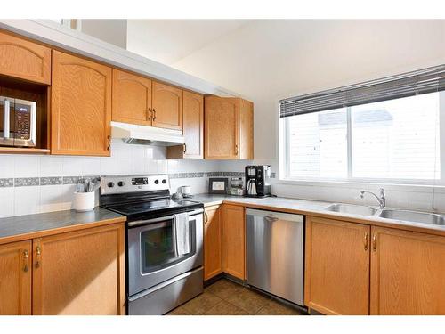 38 Coville Square Ne, Calgary, AB - Indoor Photo Showing Kitchen With Double Sink