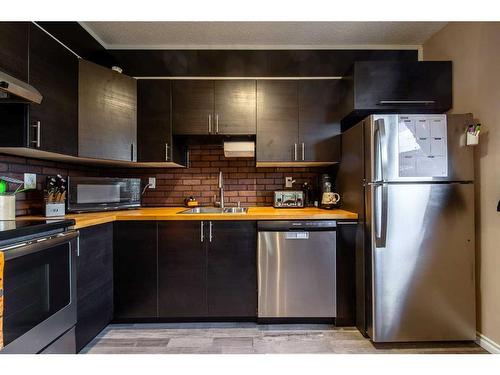 15 Wedow Drive, Whitecourt, AB - Indoor Photo Showing Kitchen With Stainless Steel Kitchen With Double Sink