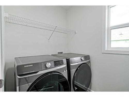 17 Creekstone Place Sw, Calgary, AB - Indoor Photo Showing Laundry Room