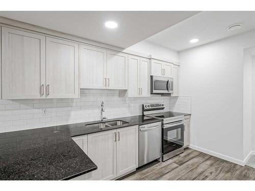 17 Creekstone Place Sw, Calgary, AB - Indoor Photo Showing Kitchen With Stainless Steel Kitchen With Double Sink