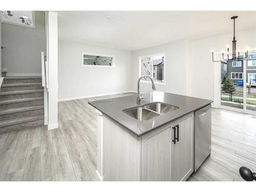 86 Belmont Passage Sw, Calgary, AB - Indoor Photo Showing Kitchen With Double Sink