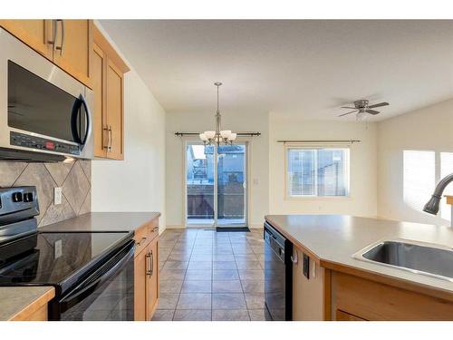 27 Kingsland Way Se, Airdrie, AB - Indoor Photo Showing Kitchen