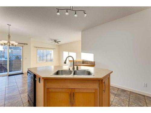 27 Kingsland Way Se, Airdrie, AB - Indoor Photo Showing Kitchen With Double Sink