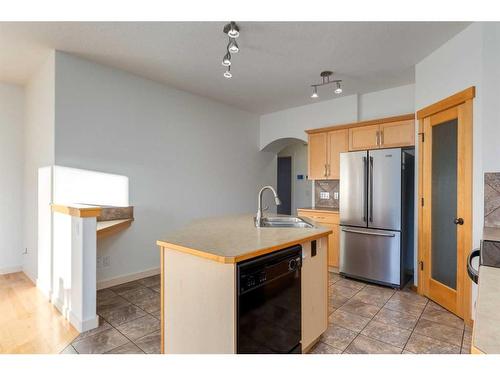 27 Kingsland Way Se, Airdrie, AB - Indoor Photo Showing Kitchen With Double Sink