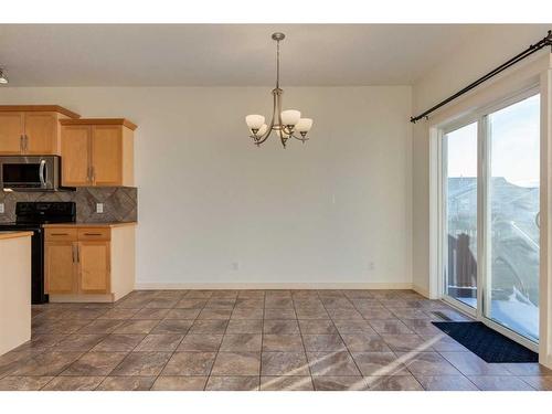 27 Kingsland Way Se, Airdrie, AB - Indoor Photo Showing Kitchen