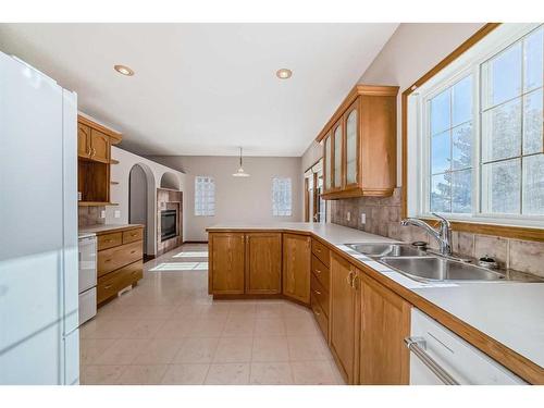 521 Cimarron Point, Okotoks, AB - Indoor Photo Showing Kitchen With Double Sink