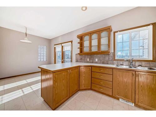 521 Cimarron Point, Okotoks, AB - Indoor Photo Showing Kitchen With Double Sink