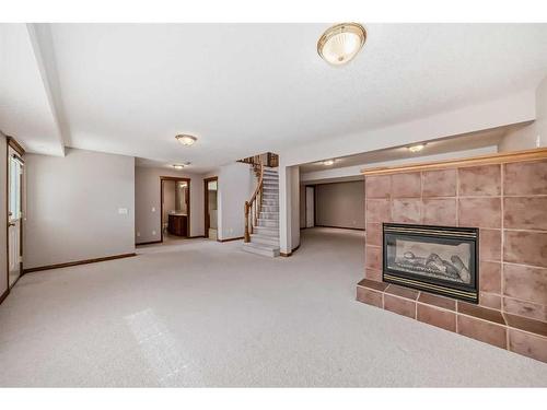 521 Cimarron Point, Okotoks, AB - Indoor With Fireplace