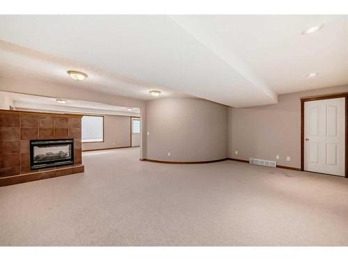 521 Cimarron Point, Okotoks, AB - Indoor With Fireplace