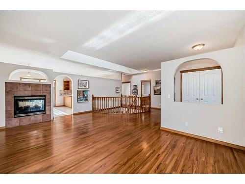 521 Cimarron Point, Okotoks, AB - Indoor Photo Showing Living Room With Fireplace