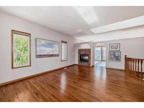 521 Cimarron Point, Okotoks, AB - Indoor Photo Showing Living Room With Fireplace