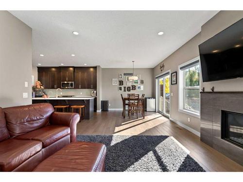 15 Walden Place Se, Calgary, AB - Indoor Photo Showing Living Room With Fireplace