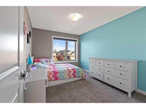 15 Walden Place Se, Calgary, AB - Indoor Photo Showing Bedroom