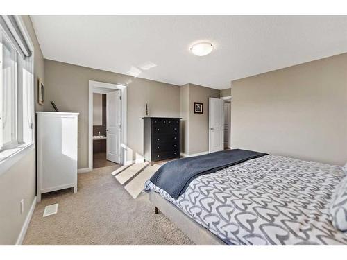 15 Walden Place Se, Calgary, AB - Indoor Photo Showing Bedroom