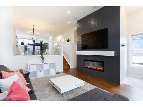 108 Magnolia Way Se, Calgary, AB - Indoor Photo Showing Living Room With Fireplace