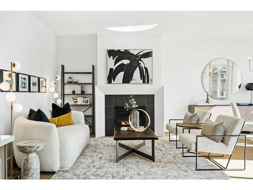 149 Creekstone Hill Sw, Calgary, AB - Indoor Photo Showing Living Room With Fireplace