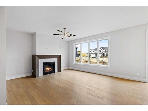 209 Creekstone Hill Sw, Calgary, AB - Indoor Photo Showing Living Room With Fireplace