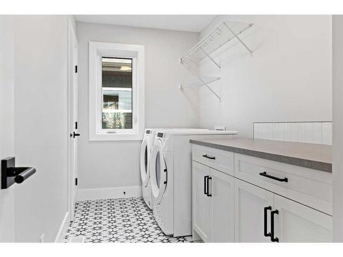 209 Creekstone Hill Sw, Calgary, AB - Indoor Photo Showing Laundry Room