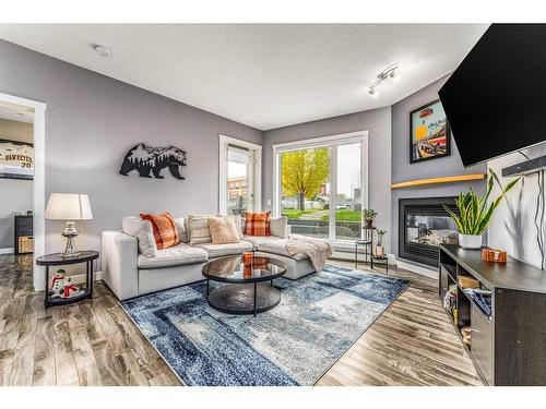 141-69 Springborough Court Sw, Calgary, AB - Indoor Photo Showing Living Room With Fireplace