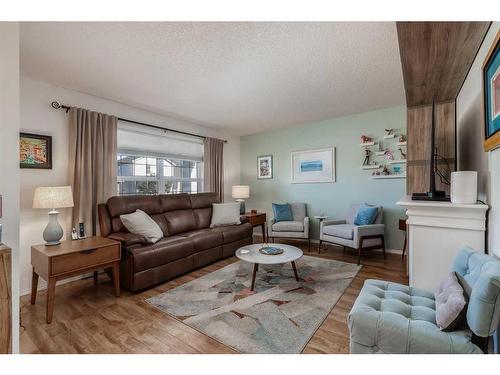 275 Sagewood Gardens Sw, Airdrie, AB - Indoor Photo Showing Living Room