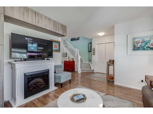 275 Sagewood Gardens Sw, Airdrie, AB - Indoor Photo Showing Living Room With Fireplace