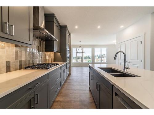 416 Sovereign Common Sw, Calgary, AB - Indoor Photo Showing Kitchen With Double Sink With Upgraded Kitchen