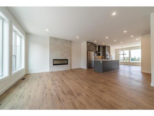 416 Sovereign Common Sw, Calgary, AB - Indoor Photo Showing Living Room With Fireplace