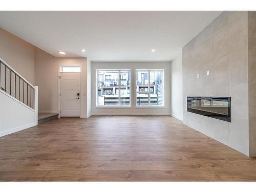 416 Sovereign Common Sw, Calgary, AB - Indoor Photo Showing Living Room With Fireplace